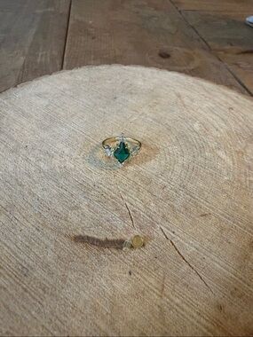 Gold-Tone Ring with Emerald Green Marquise Gem and Clear Accents
